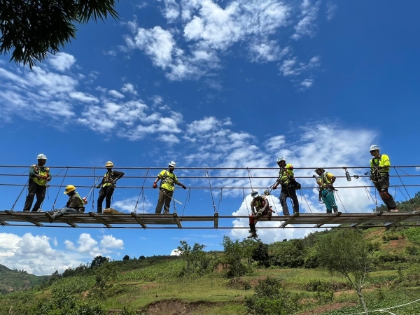 The team started laying decking from each side of the bridge. Here, the two teams meet in the middle to lay the final panels.