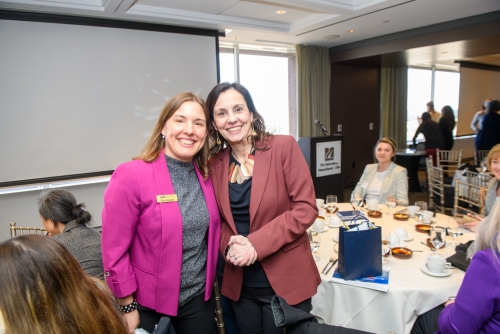 WTS-Boston president Gina Solman poses with Luciana Burdi, Director of Capital Programs and Environmental Affairs for Massport, at the April luncheon