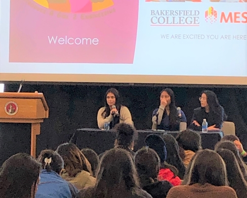 3 panelists speak to room of High School girls in STEM
